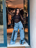 ⸻

Jeans Strappati Oversize con Dettagli a Fascia